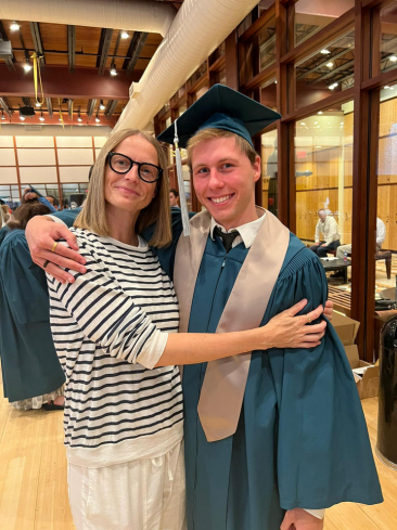 Dr. Anja Abney standing beside a graduate at a graduation celebration